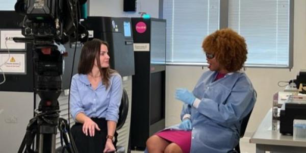 Ginger Metcalf speaks with Fox 26 Houston reporter Chelsea Edwards in lab inside the BCM HGSC